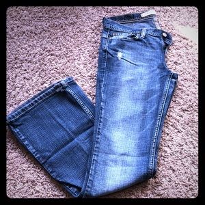 Distressed flare leg jeans.